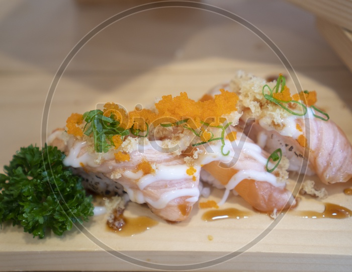 Sushi Set Sashimi and sushi rolls on Wooden Background