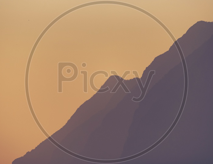 Mountain Layers With Sunset Sky in Background
