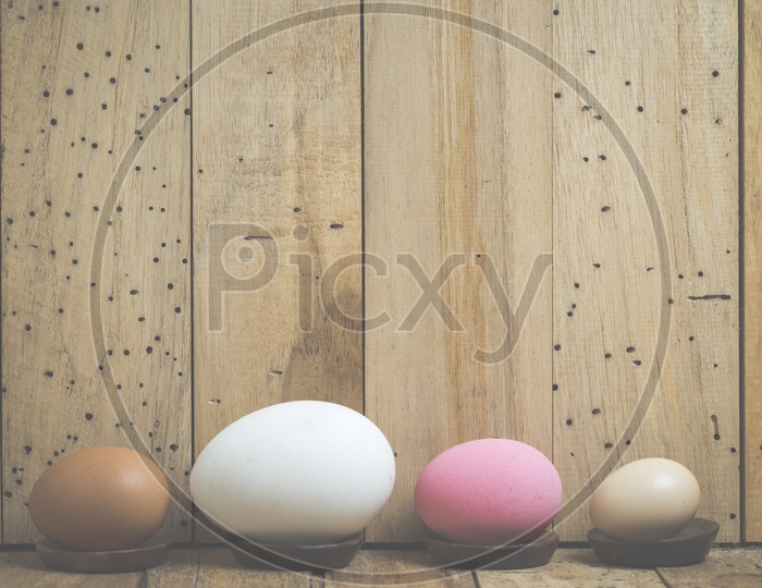 Easter Festival Creative Backgrounds With Easter Eggs Over Wooden Background