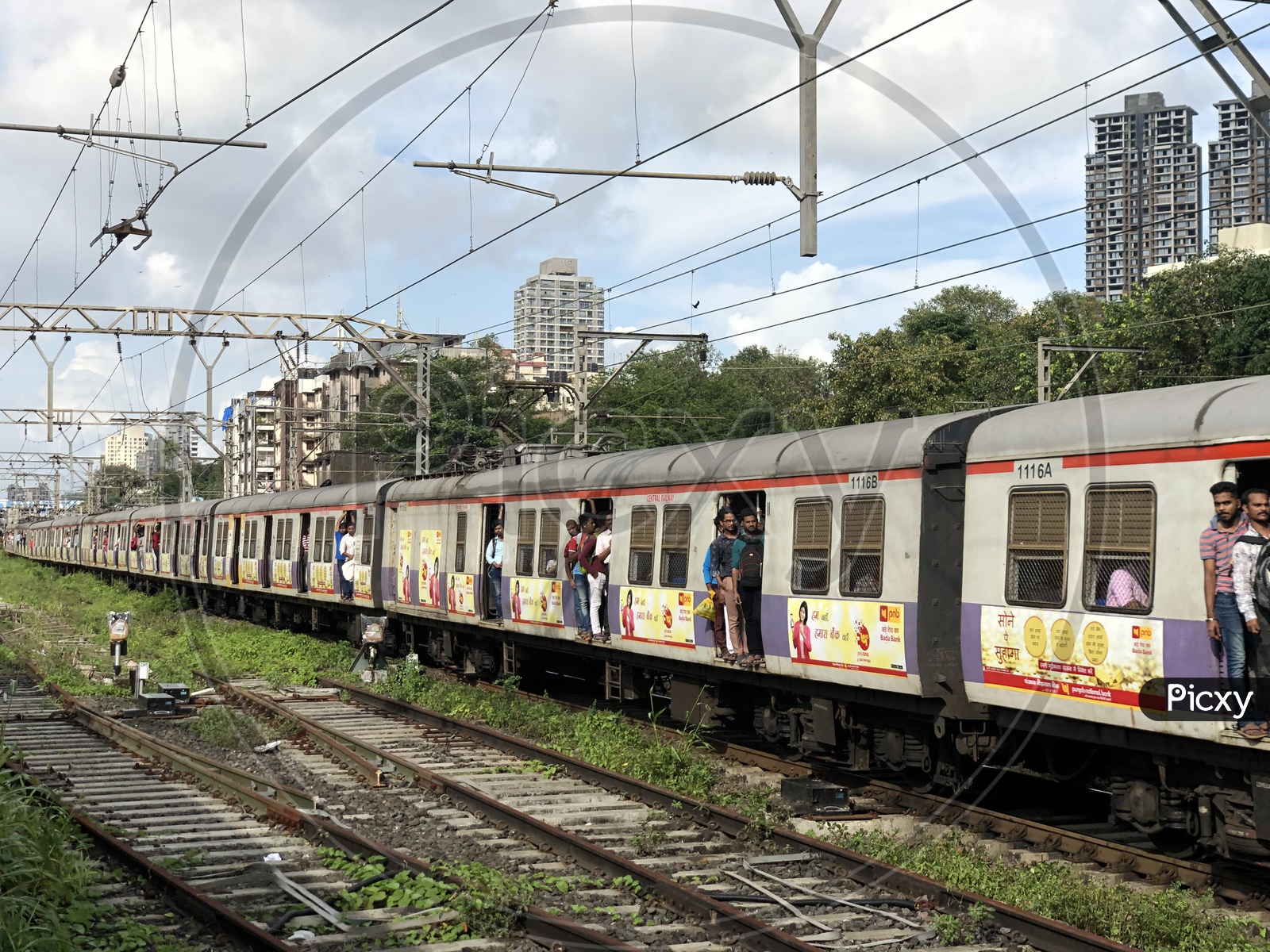 Passengers travelling On Door Steps in mumbai Suburban Train