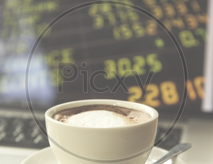 Coffee Cup With Laptop Bokeh Background