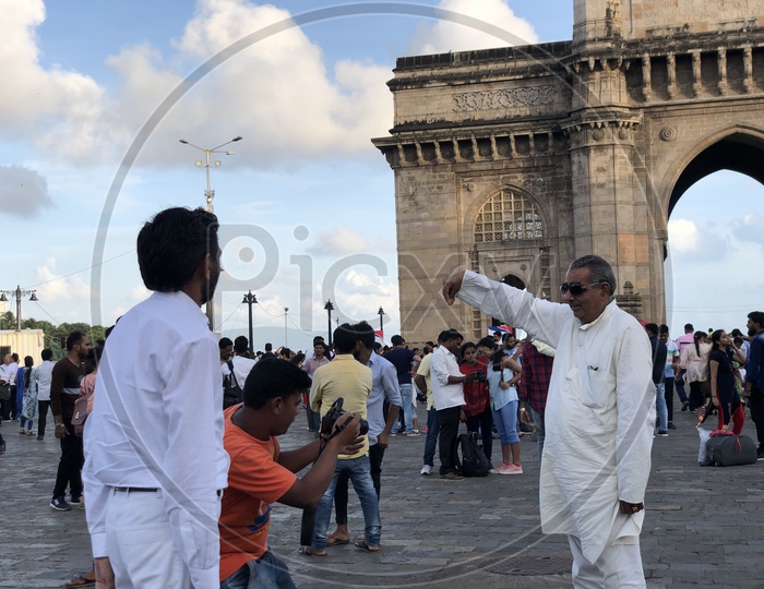 Tourists Taking Photographs At Gate Way of India In Mumbai