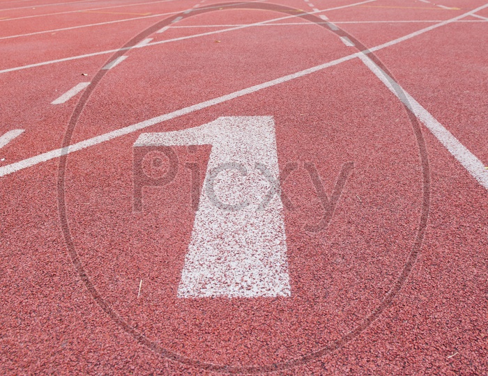"1" Numbers on red running track At a Stadium