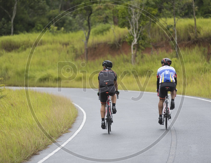 Activities of Mountain Bikers challenging themselves uphill on a Long Weekend Sporting and Fitness at Khao yai national park.