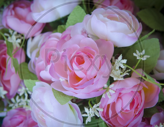 Artificial rose flowers in a Bouquet Closeup