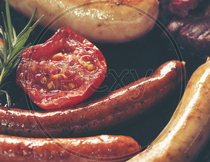 Closeup Shot of Sausage set with tomato