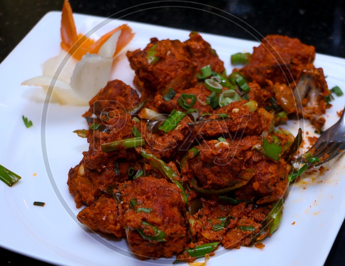 chilly chicken dish with sauce