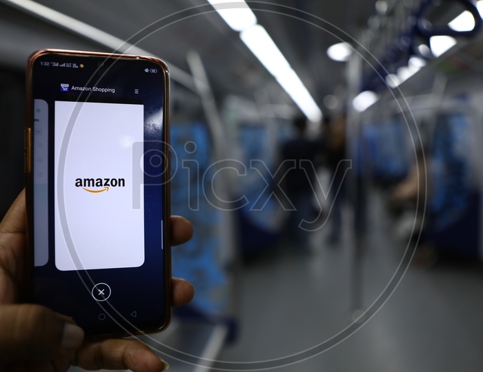 Indian Man using Amazon App for shopping on Smartphone