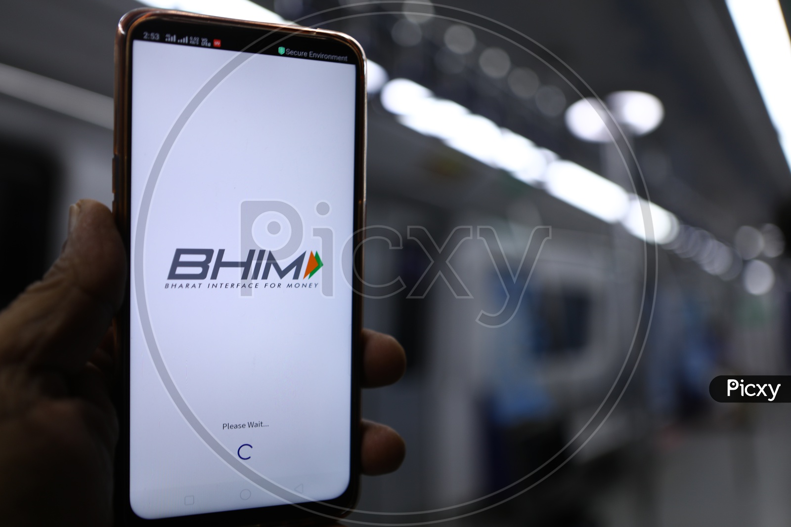 Indian Man using BHIM UPI payments app in smartphone