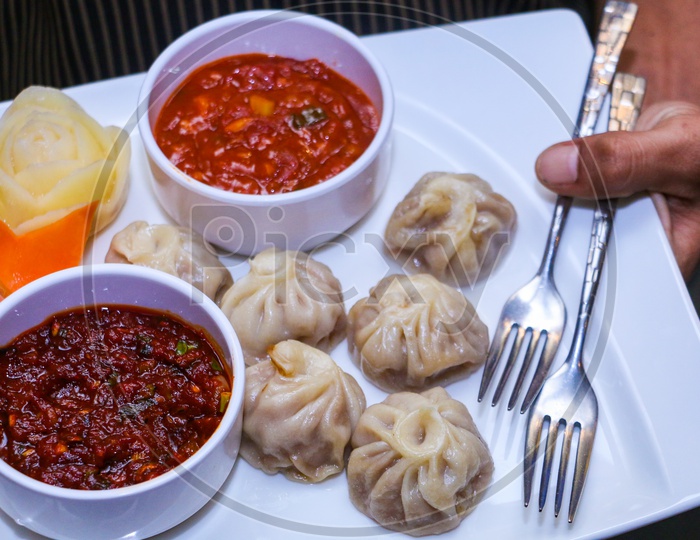 momo with red chilly sauce and tomato sauce