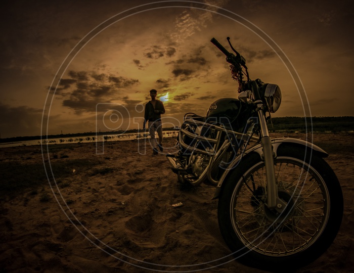 royal enfield in sunset