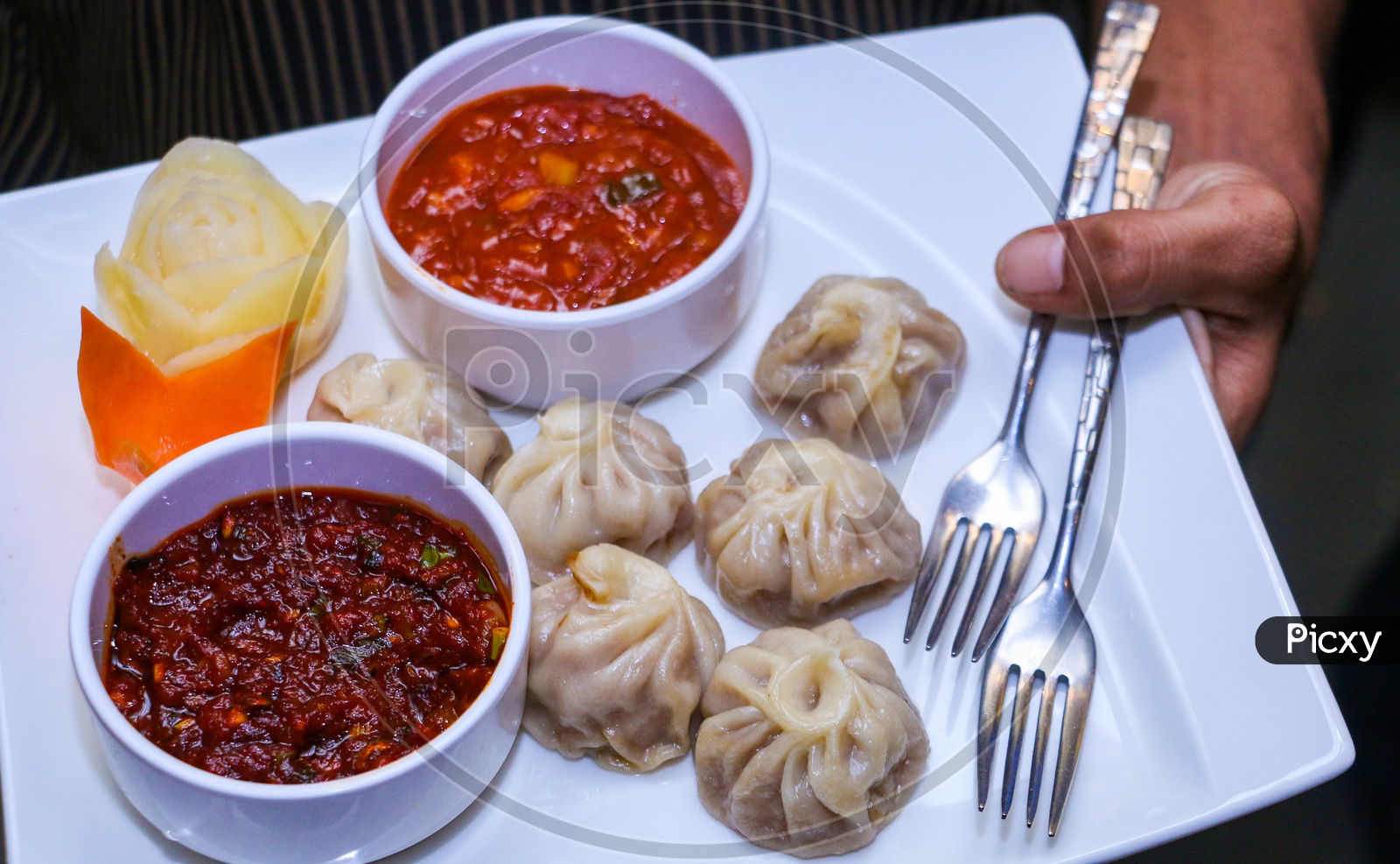 momo with red chilly sauce and tomato sauce