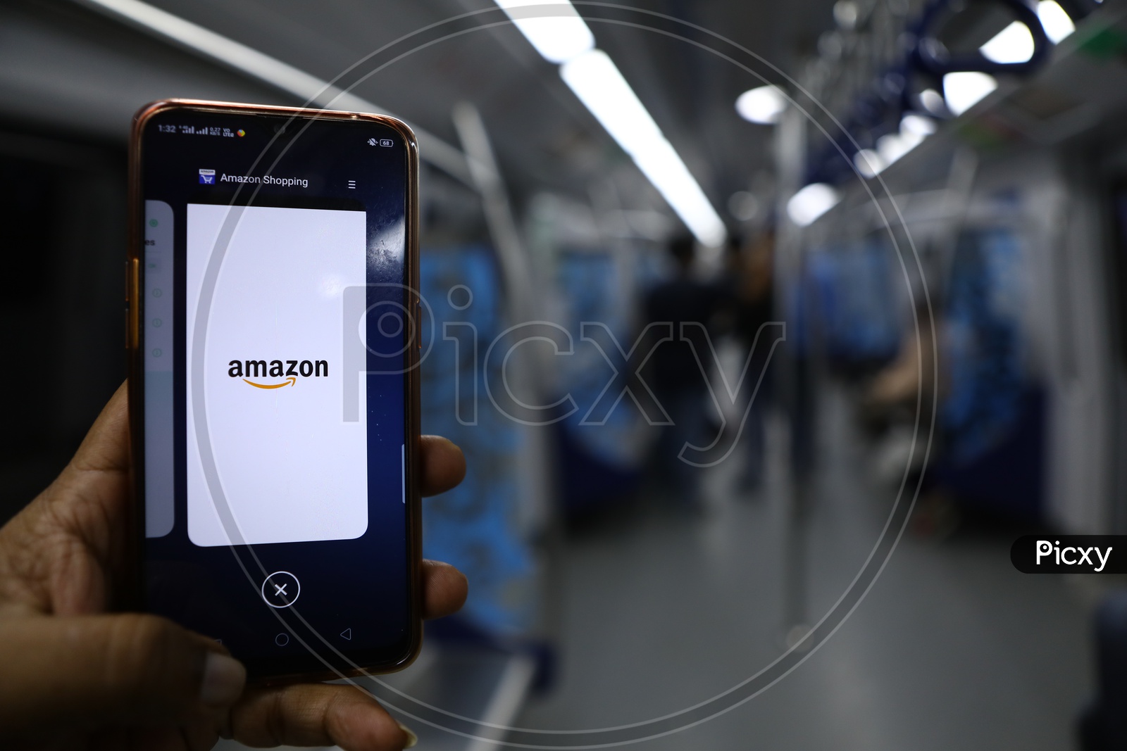 Indian Man using Amazon App for shopping on Smartphone