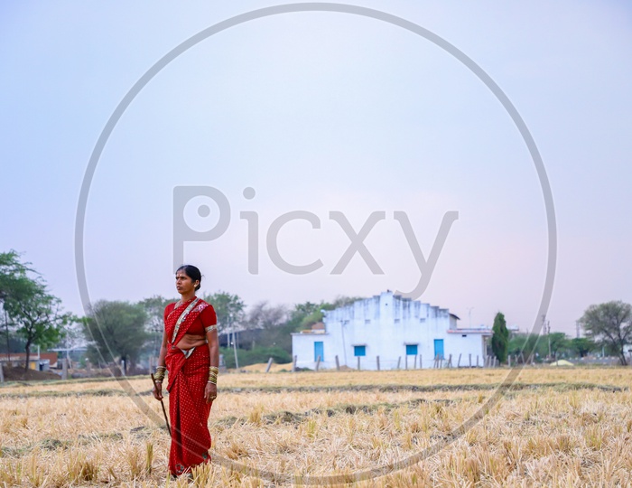 woman standing in farm land
