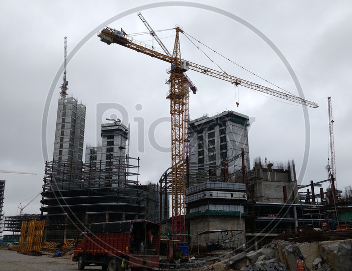 Big cranes constructing a sky scraper or a sky rise building