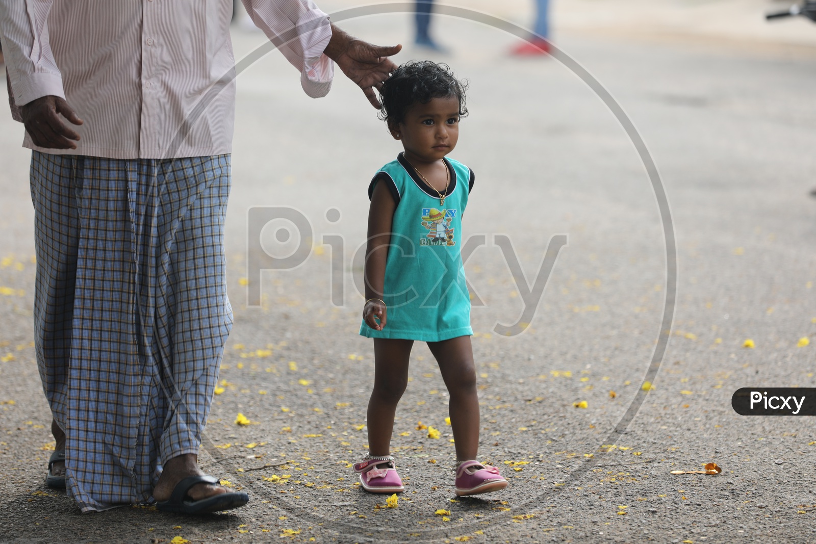Indian Little girl walking on the road