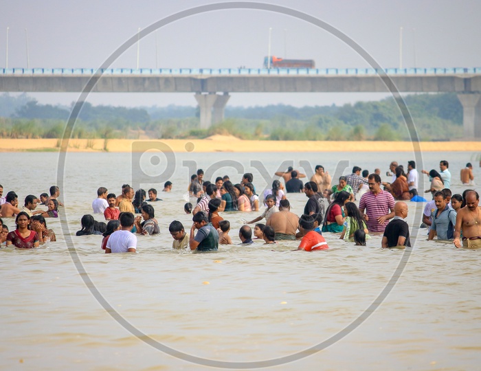 Indian Hindu Devotees Taking Holy Bath in Godavari River During Godavari Pushkaralu  in Rajahmundry
