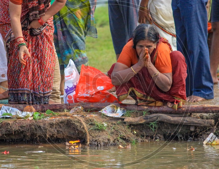 Indian Woman Hindu Devotee Praying To river Godavari During Pushkaralu