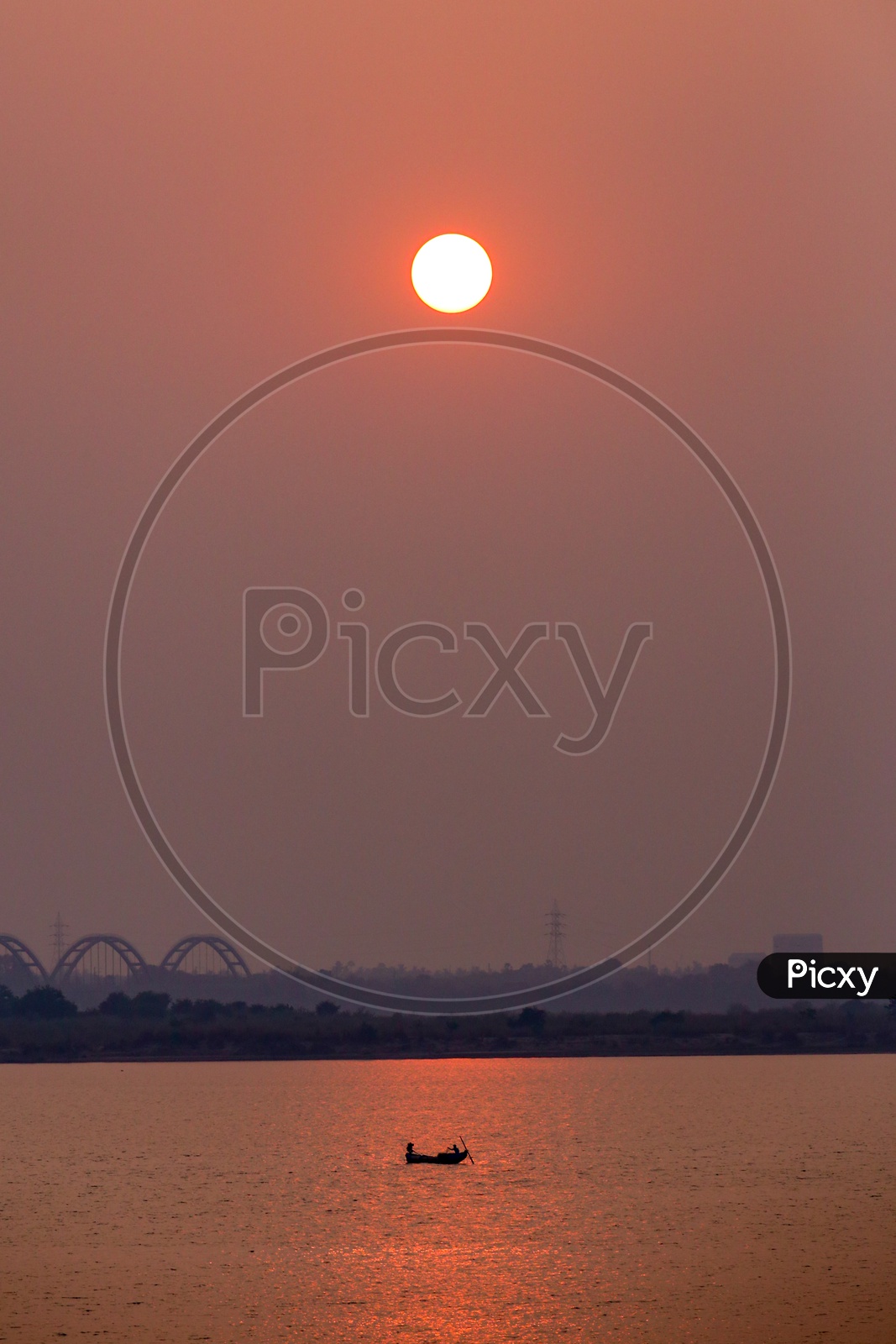 Rajahmundry Arch Bridge With Sunset Bright Round Sun in Sky