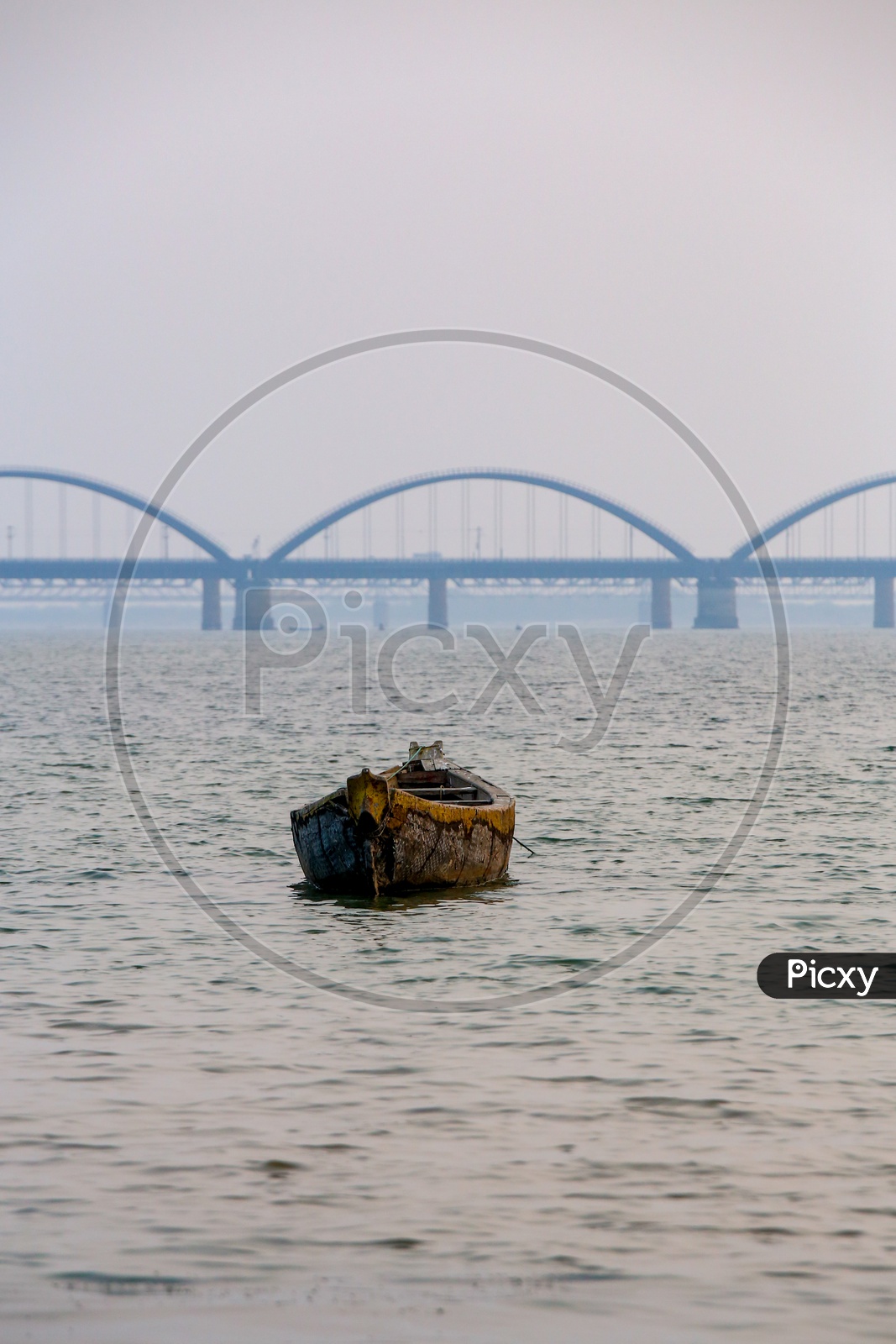Fishing Boats on Godavari River With Arch Bridge in Background