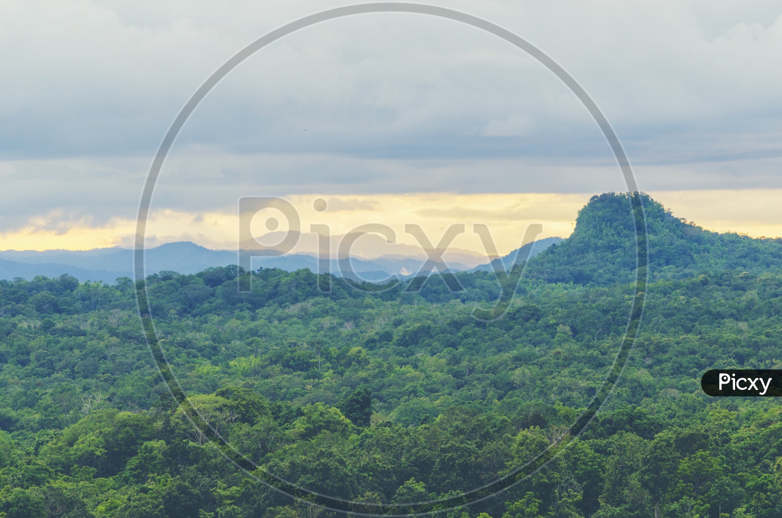 Landscape Of  Tropical Forest With Mountains And Sky Forming A Background