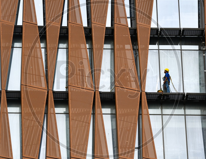 Facade  Cleaner At a Corporate Building THE SKY VIEW  Cleaning The Buildings Facade Glass