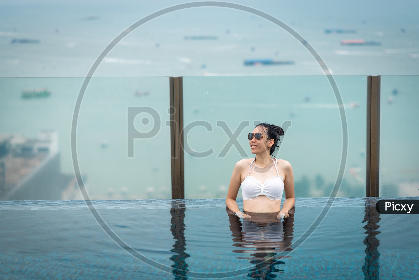 woman relaxing in swimming pool