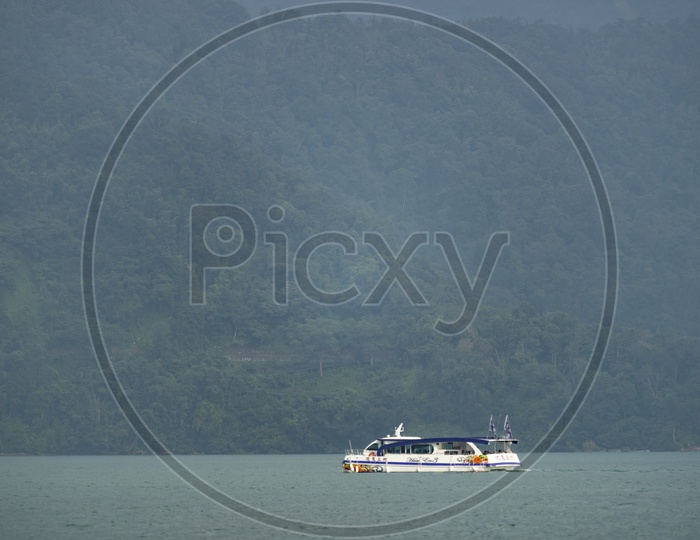 Tourist boats docking in peachful morning at Shuishe Pier, Sun Moon Lake, Taiwan.