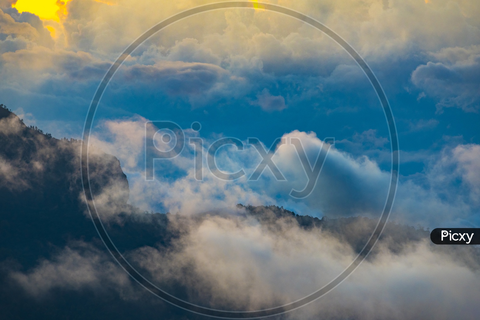 Mountains, clouds during sunset. Beautiful natural landscape in the summer time