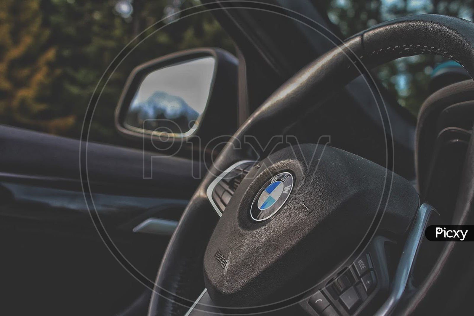 BMW Steering Wheel with mirror in the background