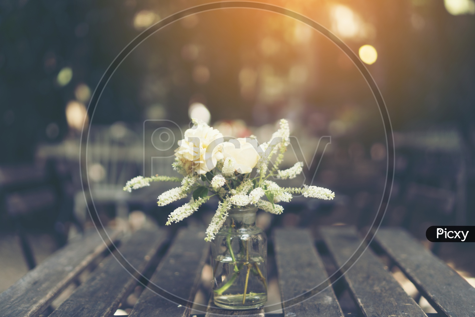 Flowers In a Flower Vase on Wooden Table