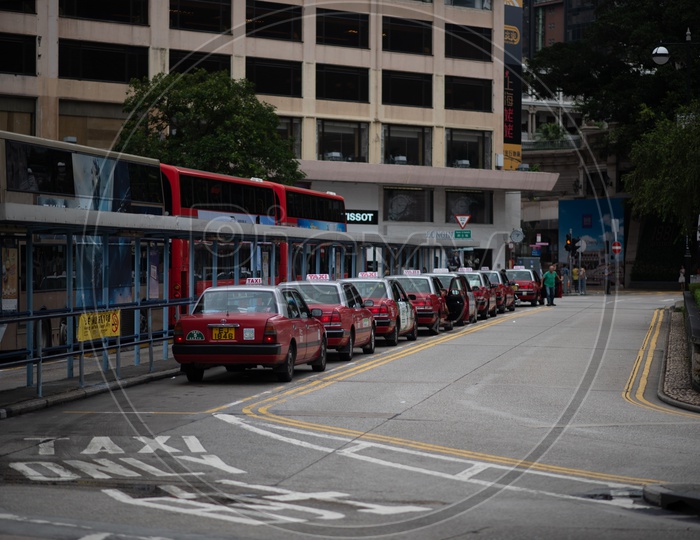 Taxis Parked in a Row At a Taxi Station in Hong Kong City