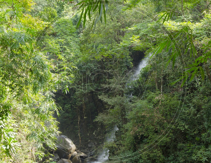 Water Falls Falling From Green Mountains in Tropical Forest