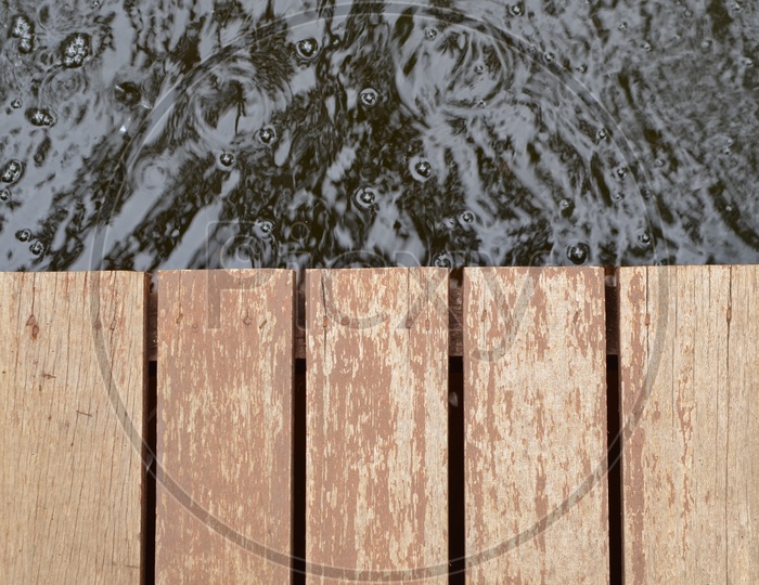 grunge wood panels Of a Wooden bridge  and Water Forming a Background