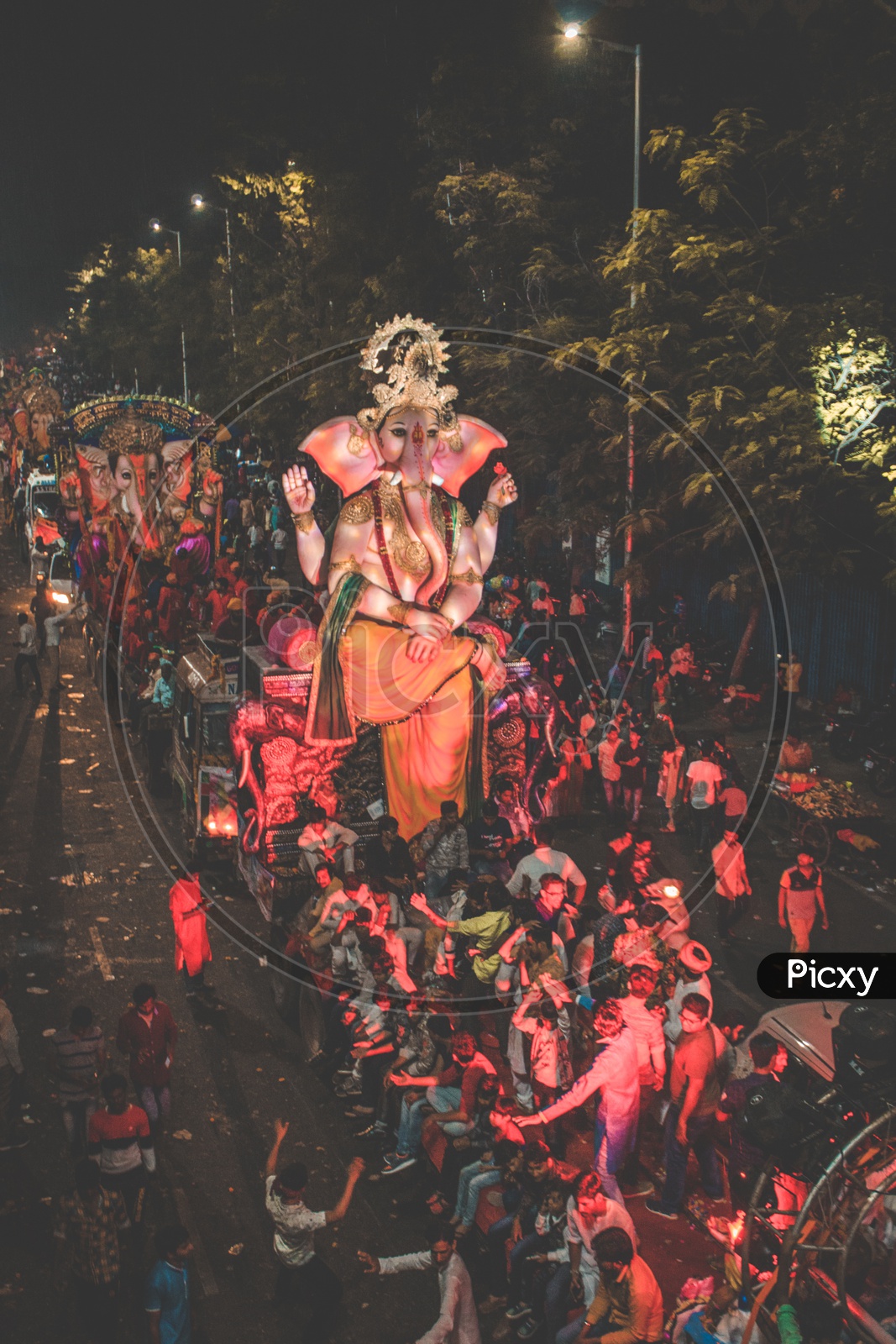 People dancing in front of huge ganesh idol