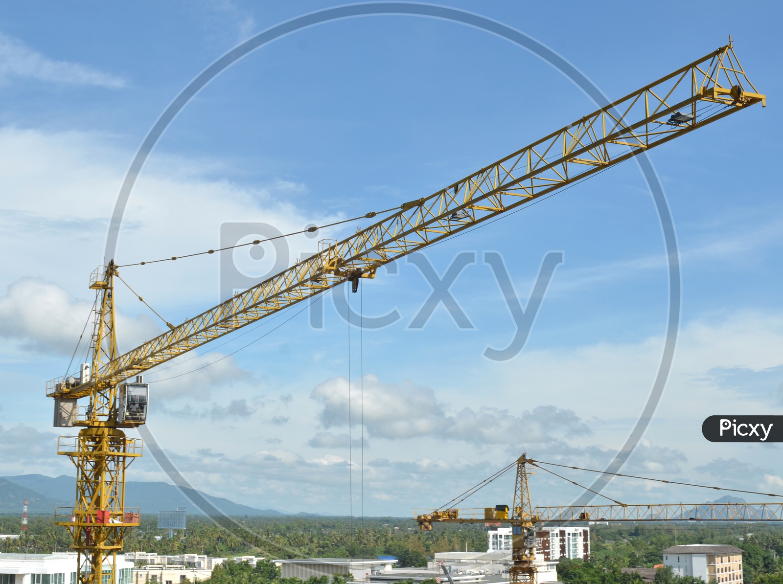 Heavy Crane and building working progress at a construction site