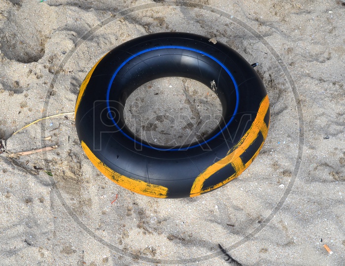 Stack of rubber tire in a Beach Sand