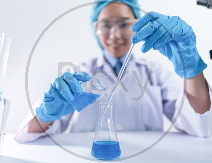 Woman Researcher Testing Or mixing Chemical In a Laboratory