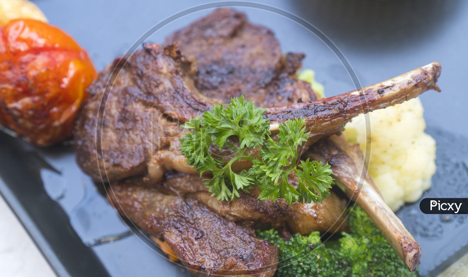 Grilled Lamb Steaks Served With fresh Broccoli