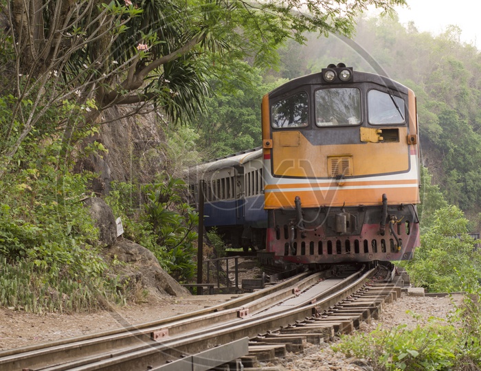 Train Running On The Narrow Gauge Track At Thailand-Burma Railway Line Built During World War II