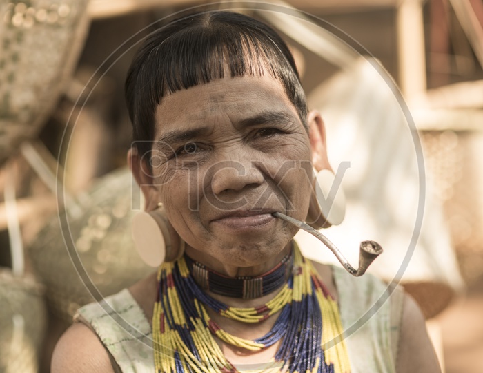 Tribal Woman With Smoke pipe in Thailand
