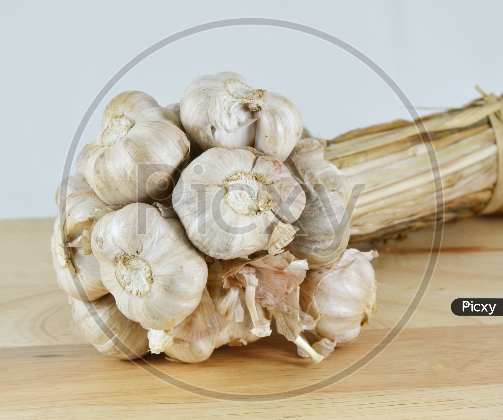 Garlics on a wooden table with a selective focus