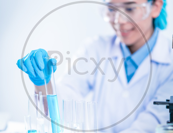 Researcher Collecting Chemical Samples in  Biotechnology Lab As a Part Of Experiments   in Biotechnology Laboratory