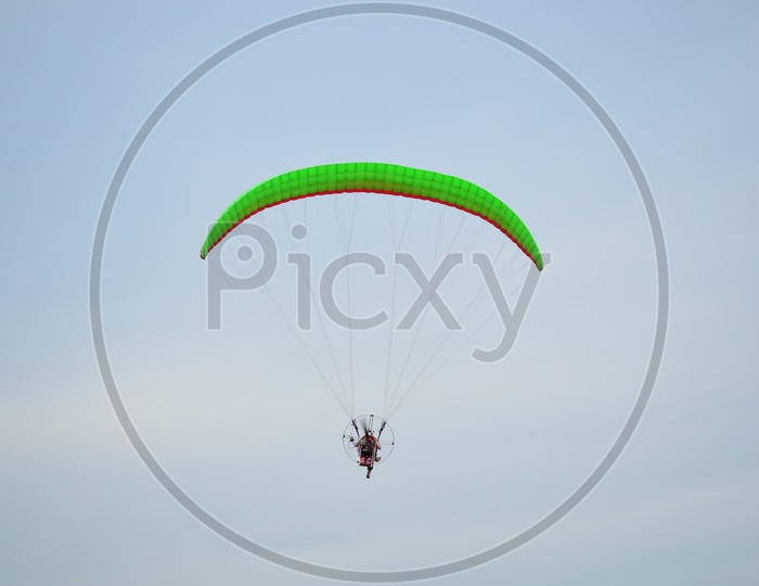 Moto paraglider Flying In Sky