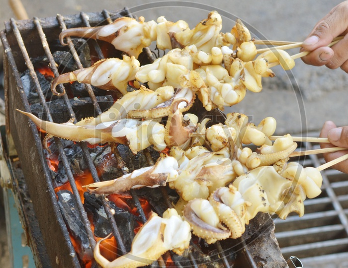 seafood barbecue of grilled squid on charcoal oven