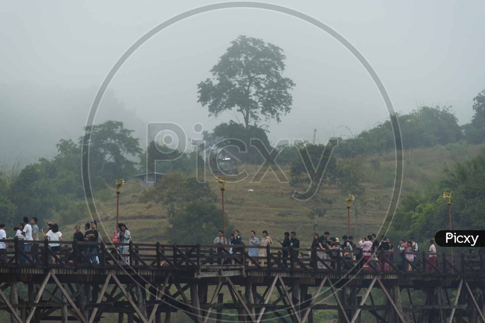 Thai People Walking On Mon Bridge or Wooden Bridge  At Sangkhla Buri in Thailand