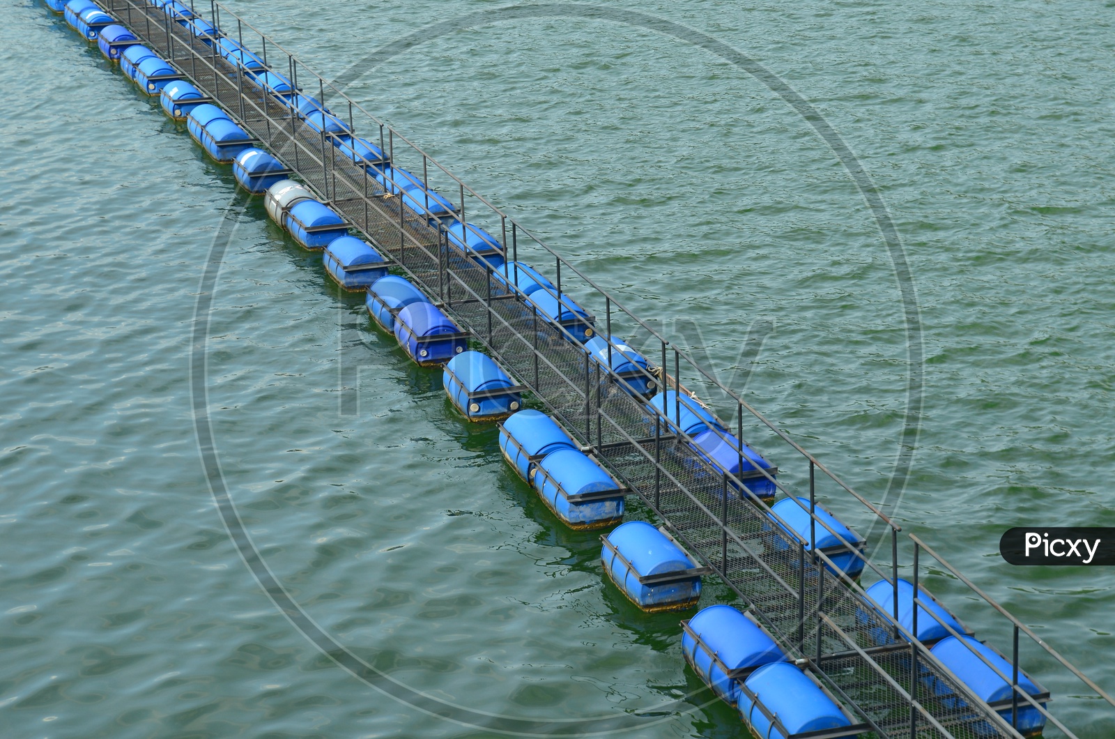 Buoy Lines  made of plastic drums floating on water in Hydroelectric Power plant of dam