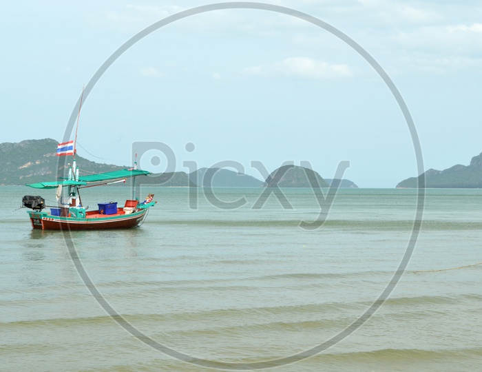 Lone Fishing Boat or Trawler on Beach Waters