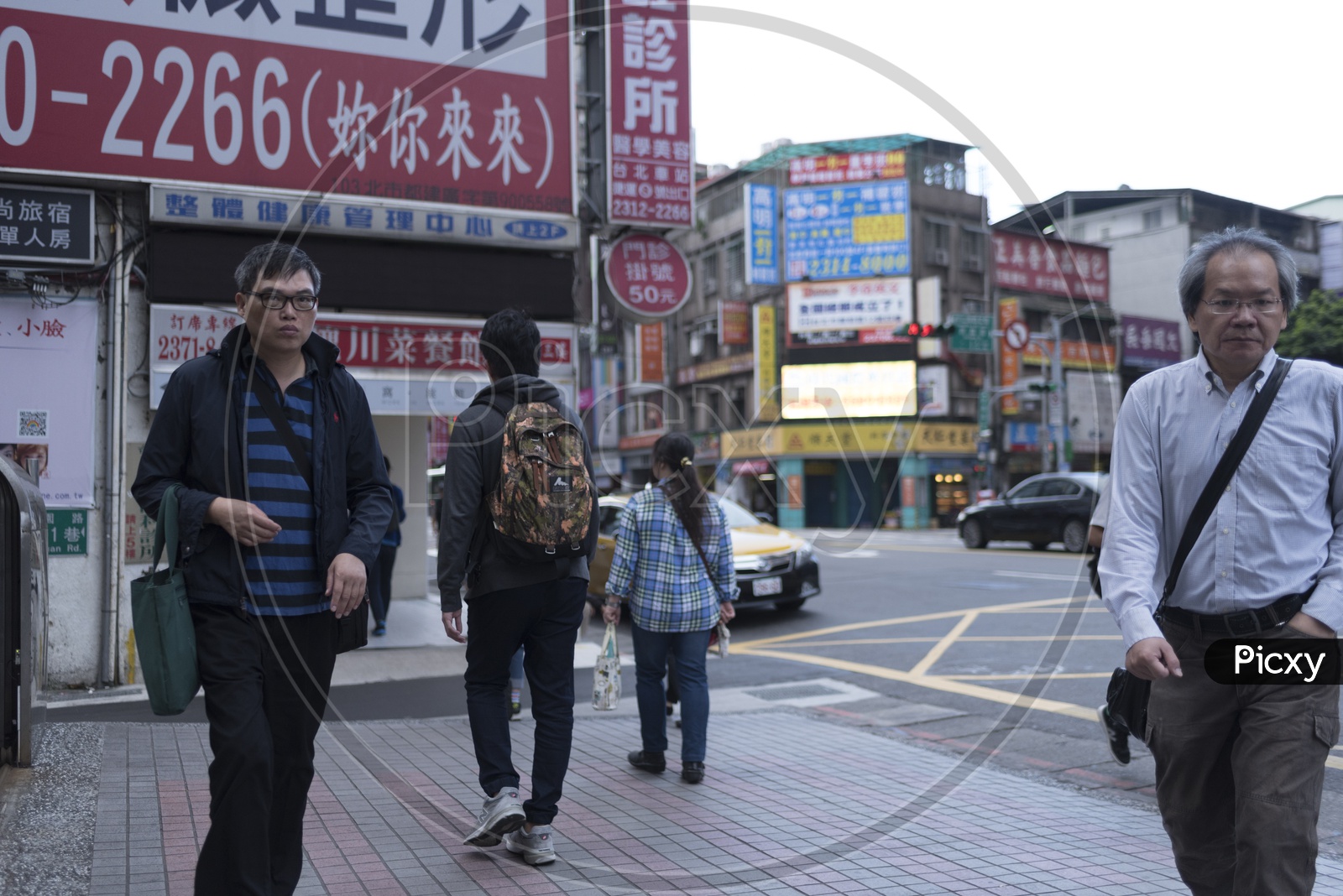 Pedestrians on The Roads of Taipei