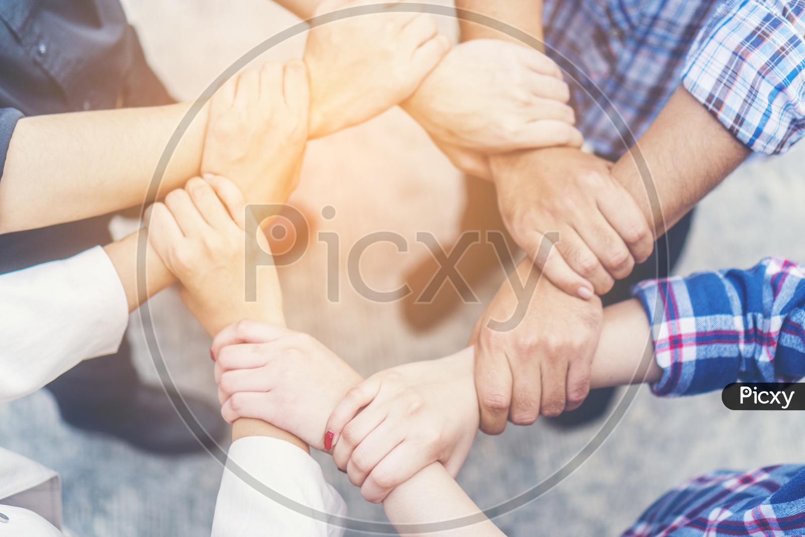 Teamwork Concept With Group of  people crossed arms in pile for win . Stack Of Hands Closeup